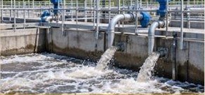 Effluent treatment plant outfall with treated water discharging from pipework